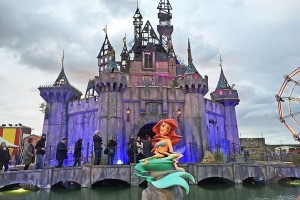 A distorted figure of the Little Mermaid. Installation view of a work by Banksy, Dismaland, 2015; photo by Carrie Seim for Architectural Digest