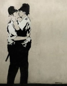 Banksy's Kissing Coppers; photo via BBC / Associated Press