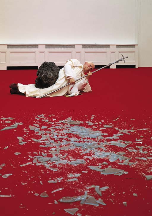 Maurizio Cattelan (b. 1960), La Nona Ora (The Ninth Hour), installation view, wax, clothing, polyester resin with metallic powder, volcanic rock, carpet, glass, dimensions variable