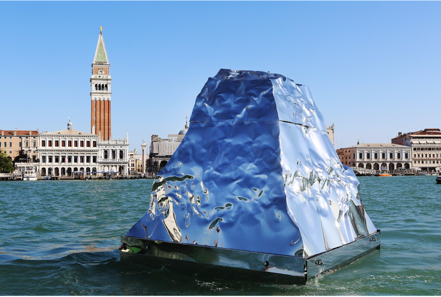 Helidon Xhixha, Iceberg, 2015; mirrored polished stainless steel, 157.5 x 118 inches; installation view at the 2015 Venice Biennale; image via Artsy